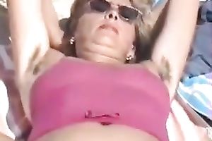 My wicked aged horny white wife flashes her unshaved cunt on a beach