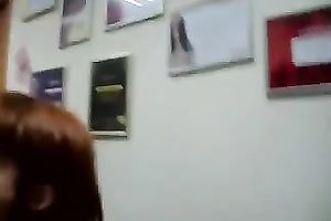 Redhead secretary knows what it takes to keep her job