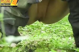 Lovely blond cheating wife with slim body in jeans makes water in the forest