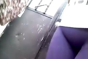 My friend, wearing constricted legging, lets me film her in the street