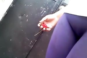 My friend, wearing constricted legging, lets me film her in the street