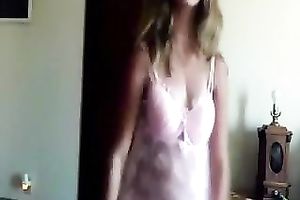 Sweet looking webcam model in pink costume puts on a precious show