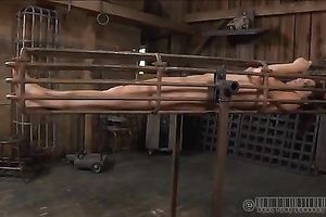 Naughty redhead with precious bum is locked in the cage