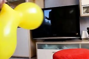 Amateur blond plays with a balloon in homemade solo