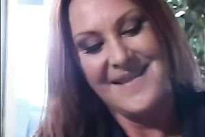 Chunky redhead cougar catches a youthful fellow on the sofa