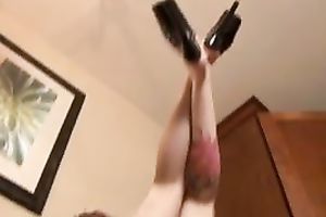 Tattooed floozy with short hair demonstrates her booty and feet