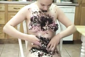 Weird non-professional whore smears her body with cake in the kitchen