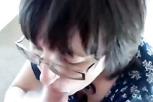 Amateur dark brown wearing glasses sucks a cock in POV video