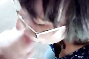 Amateur dark brown wearing glasses sucks a cock in POV video