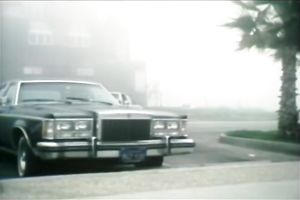 Busty blonde seductress is talking on a phone