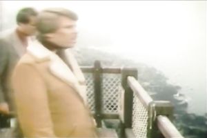 Busty blonde seductress is talking on a phone