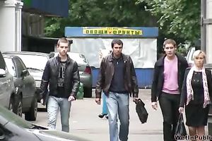 Skinny Russian golden-haired girl walks on the sidewalk and pisses