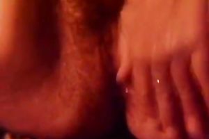 This slutty lady nearly faints while masturbating her snatch