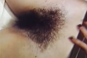 Sassy brunette beauty stuffs her hirsute vagina with a handset