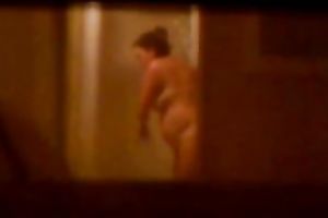 Caught my hot female guest with giant bazookas taking a shower