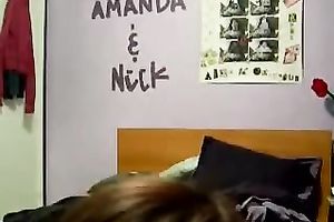 Extremely stylish coed is rubbing her pussy in front of a livecam