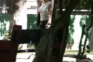 Busty brunette sweetie in Russian Federation pees when a stranger walks by
