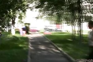 Busty brunette sweetie in Russian Federation pees when a stranger walks by