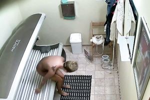 Attractive blond honey tans her dreamy body in solarium