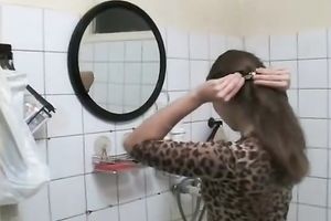 Amateur floozy Olga plays with her cum-hole in the baths and pees