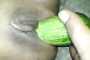 Black girlfriend masturbating with a thick cucumber