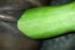 Black girlfriend masturbating with a thick cucumber