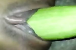 Black girlfriend masturbating with a thick cucumber