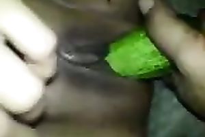 Black girlfriend masturbating with a thick cucumber