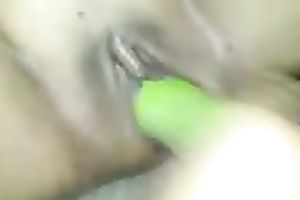 Black girlfriend masturbating with a thick cucumber