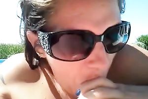 My sizzling tanned wifey favours me with a oral in a pool