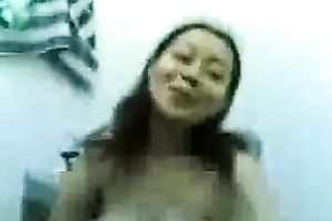 Saucy Asian nympho is showing off her well-matured melons