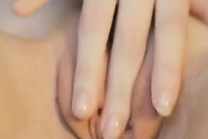 The glamorous red sex toy going in the taut pink pussy of my chick