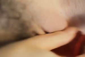 The glamorous red sex toy going in the taut pink pussy of my chick