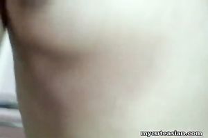 Asian hoe sucks her lover's tiny jock and then straddles him on top