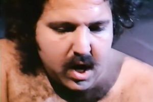 Busty fair-haired woman receives screwed in a car in retro porn scene
