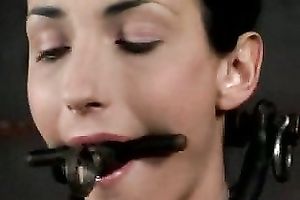 Slim brunette hair with a gag in her face hole is punished by her taskmaster