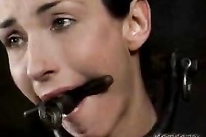 Slim brunette hair with a gag in her face hole is punished by her taskmaster