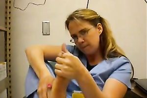 Nerdy woman in nurse uniform licks her toes in front of a livecam