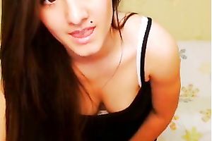 Long-haired brunette hair sweetheart strips and plays with her sweet pussy