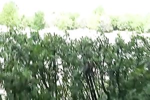 Her hands are chained and her legs are fastened up with ropes