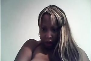 Ebony big beautiful woman enjoys kneading her heavy tits in front of a cam
