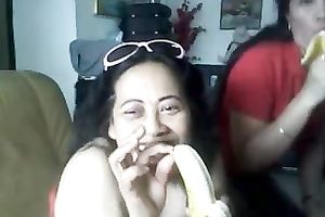 Plump Thai doxy is showing off her wobblers and engulfing on banana