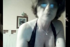 Mature white lady still has seductive cleavage and large boobs