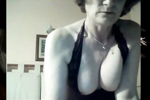 Mature white lady still has seductive cleavage and large boobs