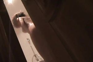 Hidden livecam clip with a wife washing her body in the bathtub
