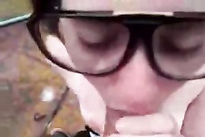 POV scene with a dark brown hussy engulfing my boner in the yard