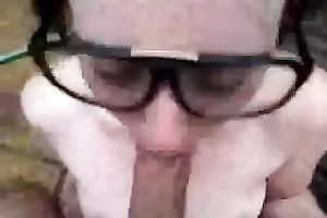 POV scene with a dark brown hussy engulfing my boner in the yard