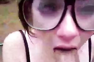 POV scene with a dark brown hussy engulfing my boner in the yard