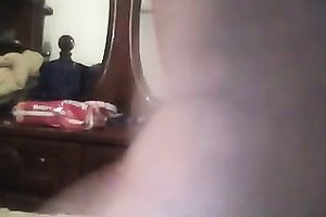 Just a large soaked dark butt in pajamas filmed from behind