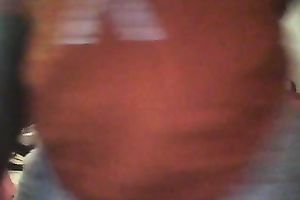 Just a large soaked dark butt in pajamas filmed from behind